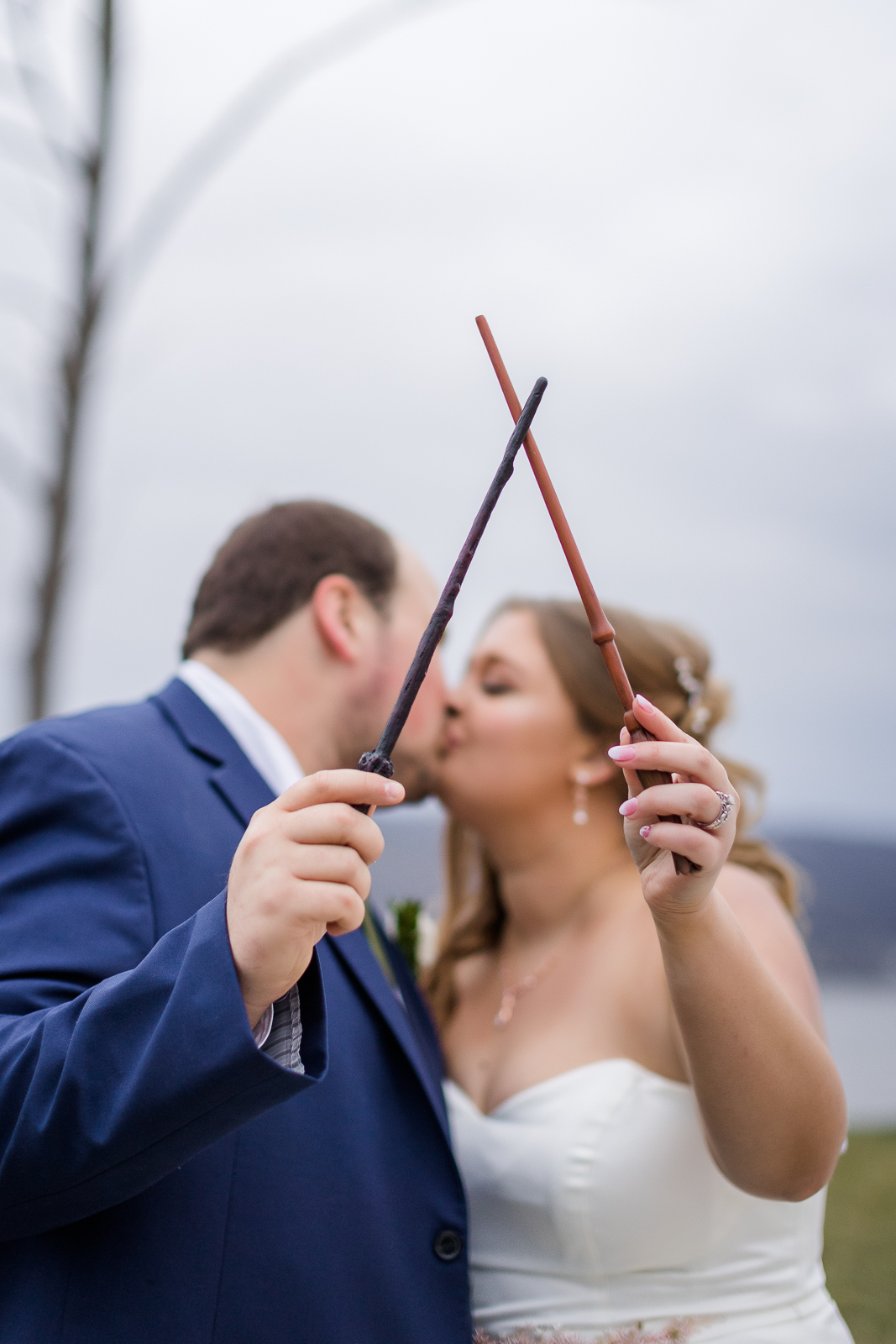 Portrait of bride and groom with harry potter wands
