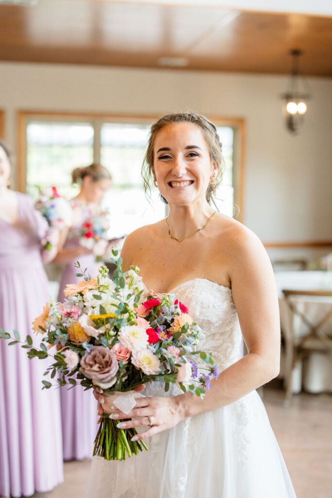 smiling bride with bouquet from the marmalade lily