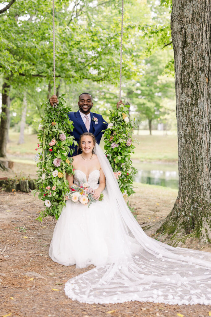 Portrait of bride and groom on the swing at The Marmalade Lily