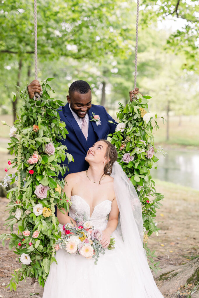 Portrait of bride and groom on the swing at The Marmalade Lily