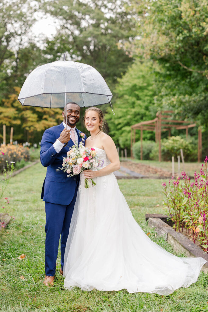 Portrait of bride and groom in gardens at the marmalade lily