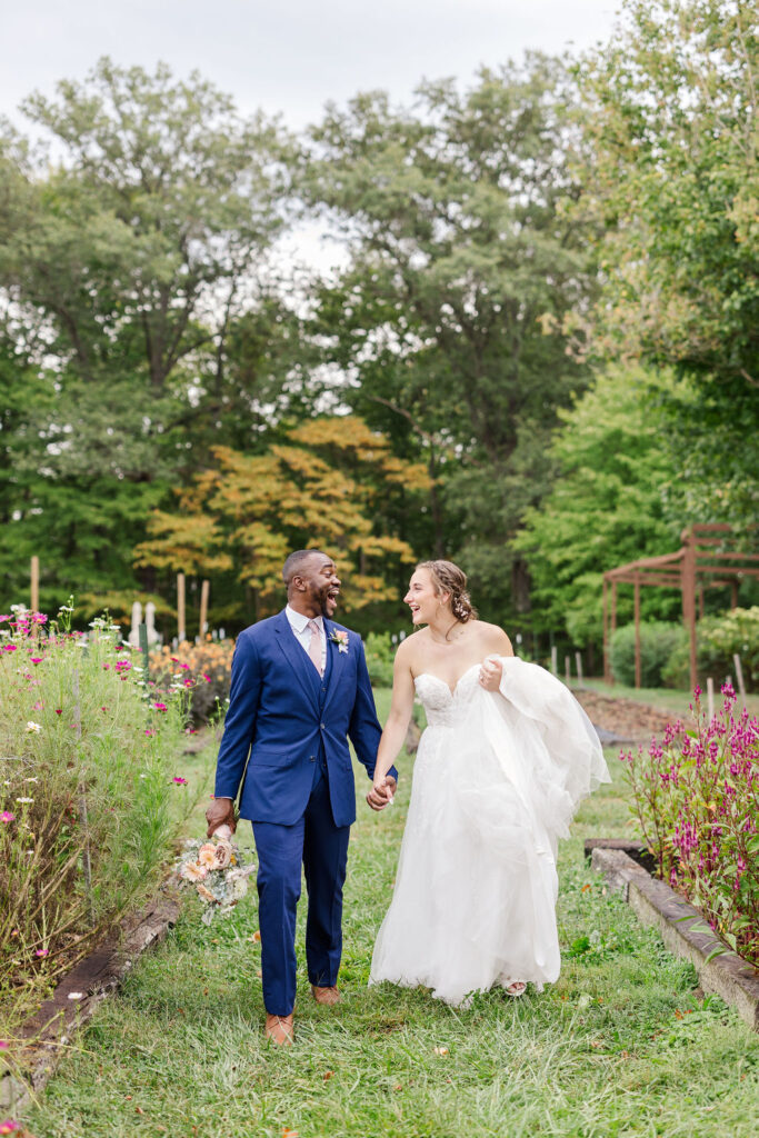 Portrait of bride and groom in gardens at the marmalade lily