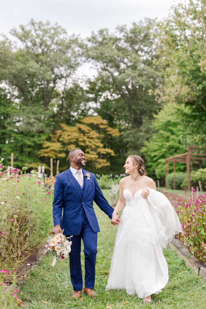 Portrait of bride and groom in gardens at the marmalade lily