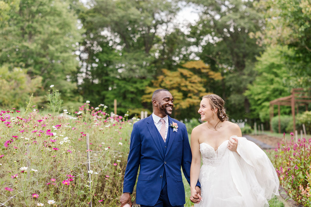 Portrait of bride and groom in gardens at the marmalade lily