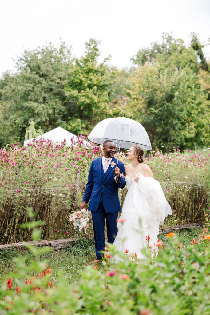 Portrait of bride and groom in gardens at the marmalade lily