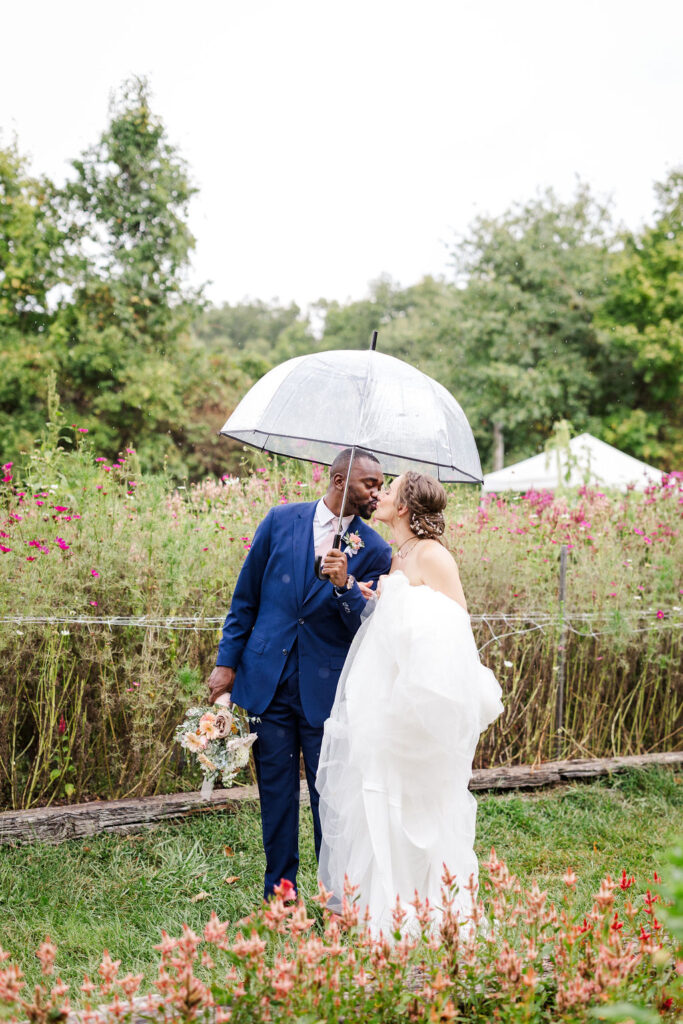 Portrait of bride and groom in gardens at the marmalade lily