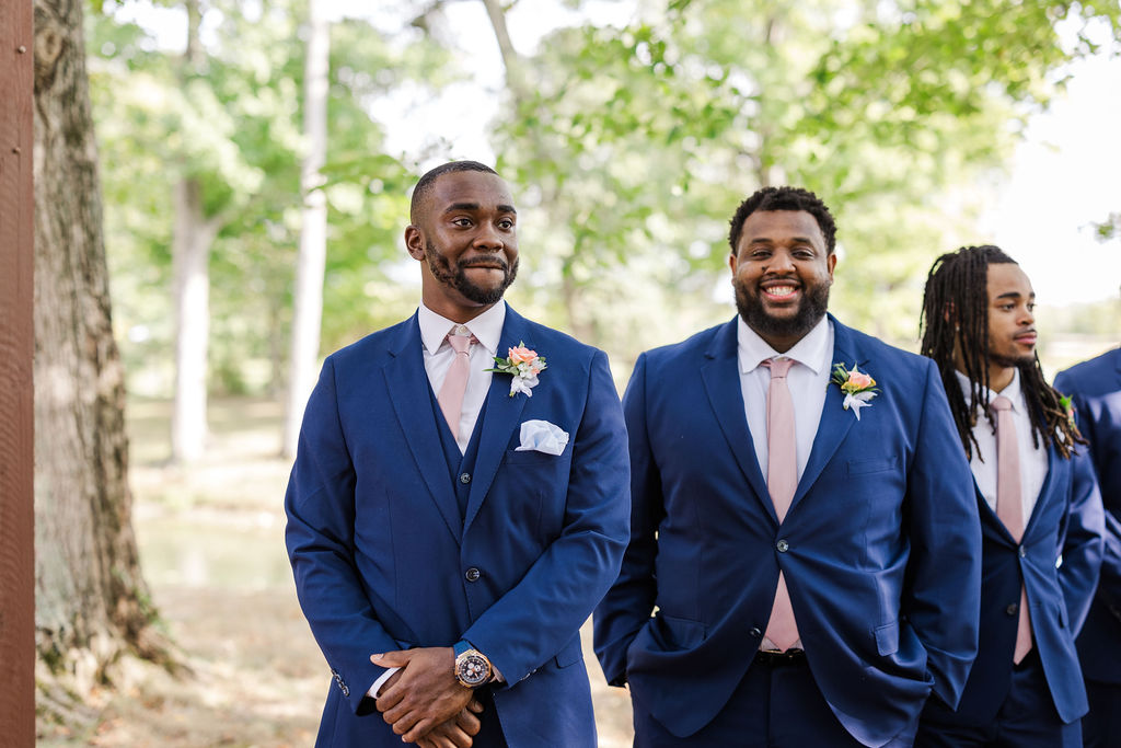 Photo of groom seeing bride walk down the aisle at the marmalade lily