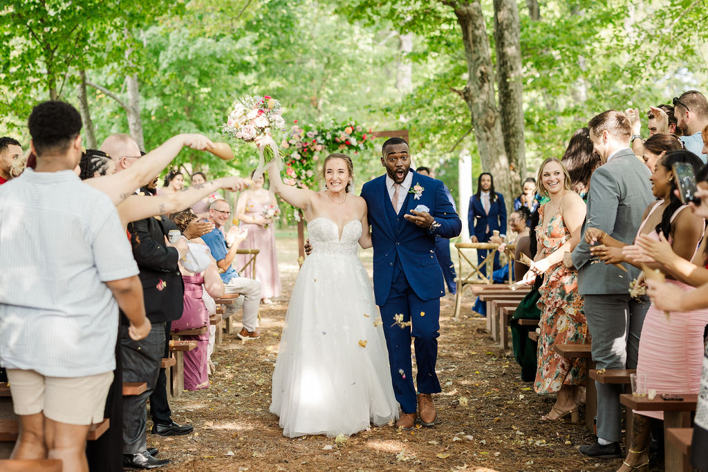 Bride and groom recessional at the marmalade lily