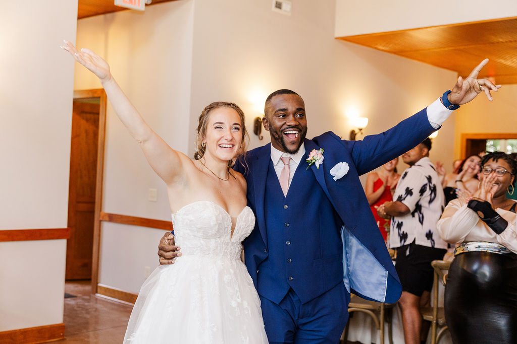 Bride and groom's entrance to reception at the marmalade lily 