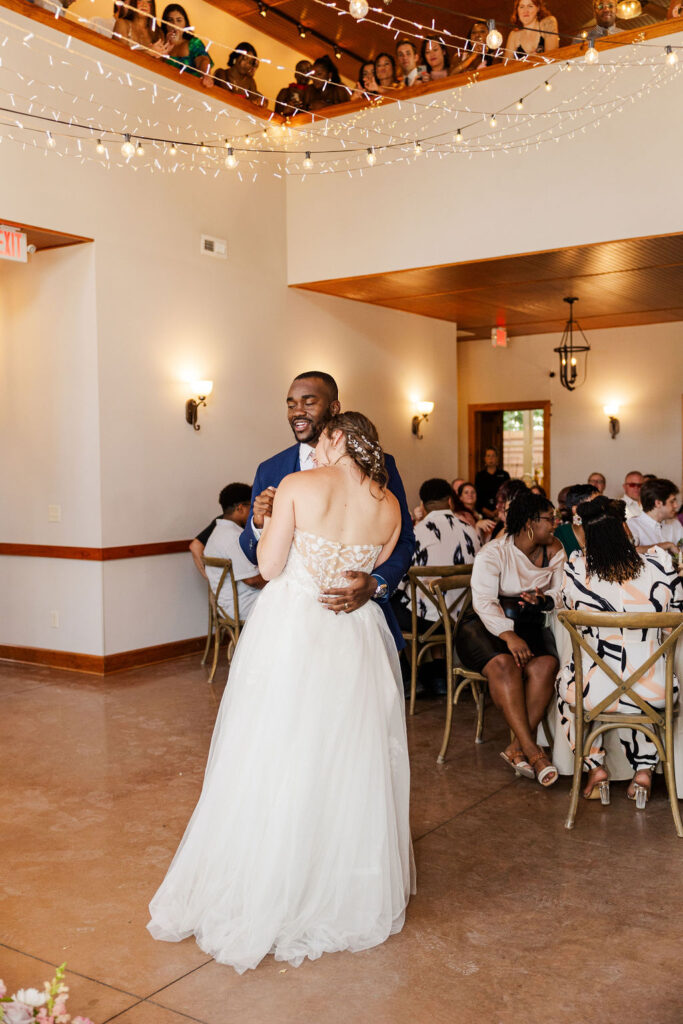 Bride and groom's first dance at reception at the marmalade lily 