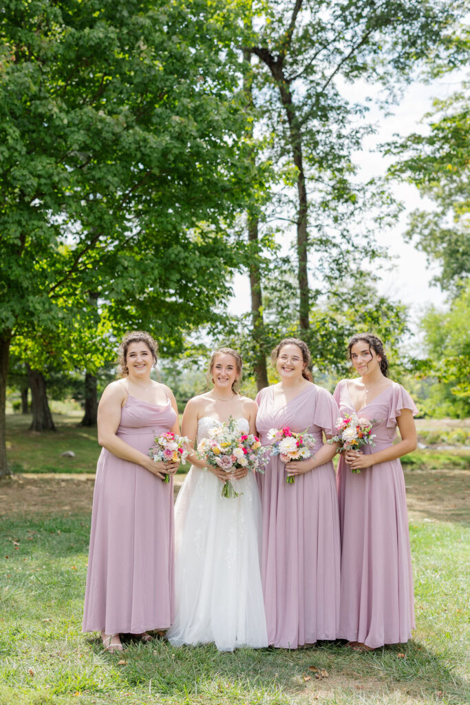 Bridesmaids in the gardens at the marmalade lily