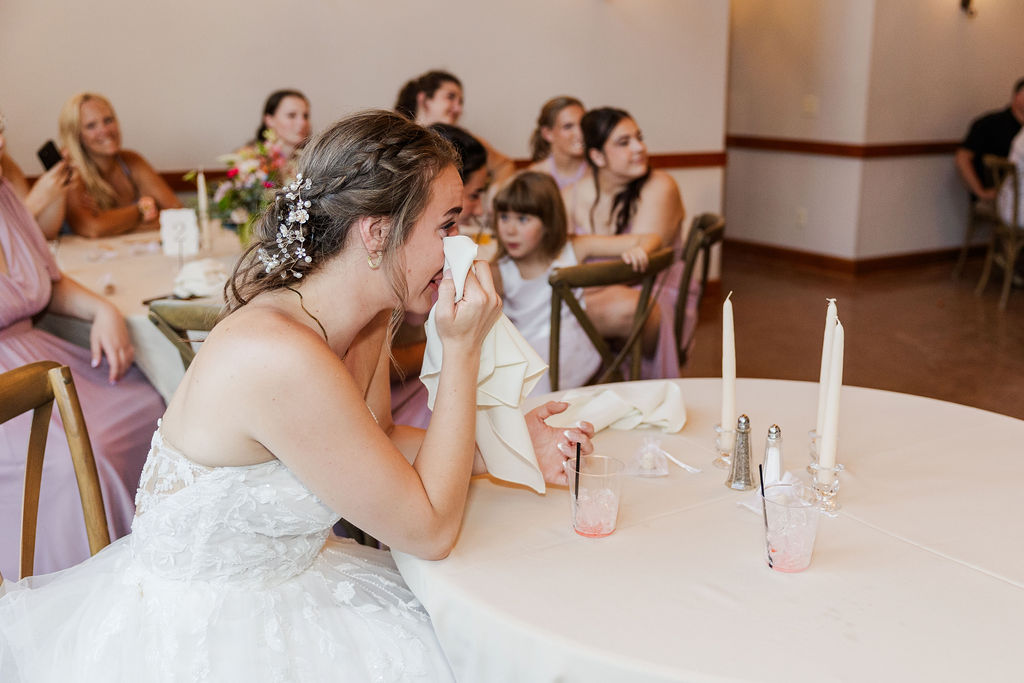 Bride crying tears of joy at the marmalade lily