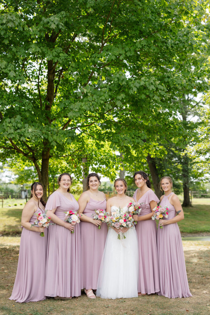 Bridesmaids in the gardens at the marmalade lily