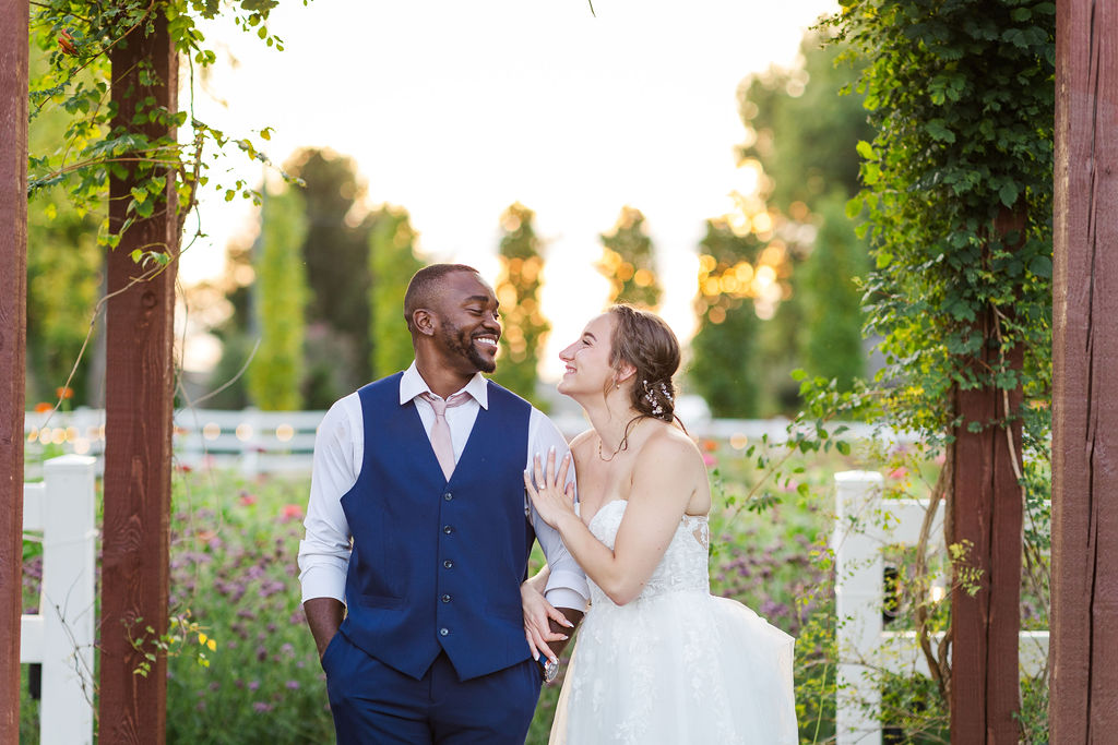 Sunset portraits of the bride and groom in the gardens at the marmalade lily