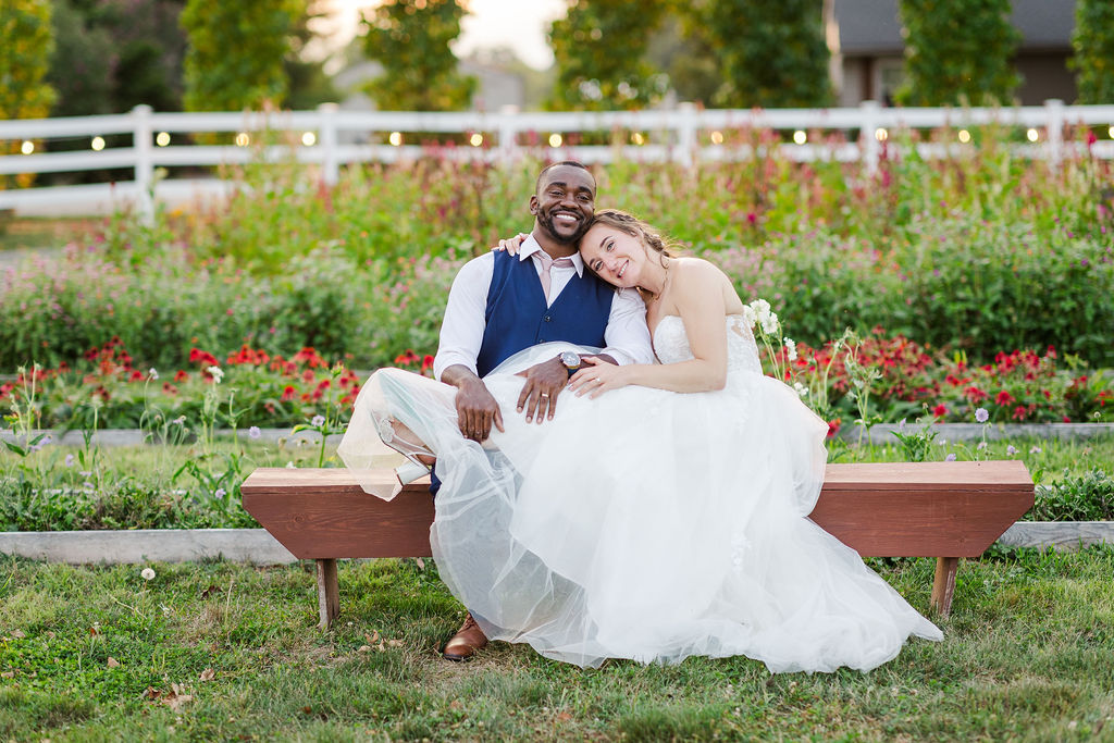 Sunset portraits of the bride and groom in the gardens at the marmalade lily