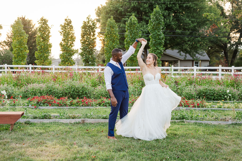 Sunset portraits of the bride and groom in the gardens at the marmalade lily