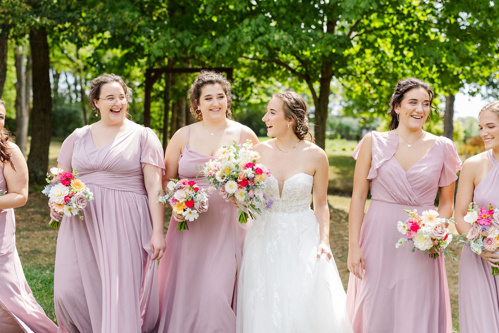 Bridesmaids in the gardens at the marmalade lily