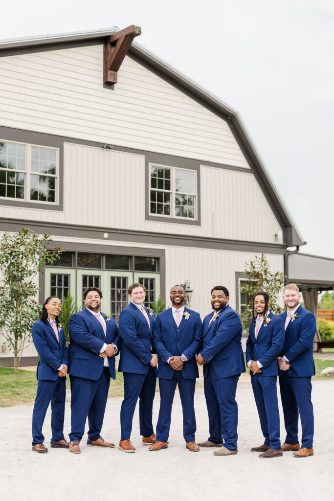 Groomsmen in front of the barn at The Marmalade Lily