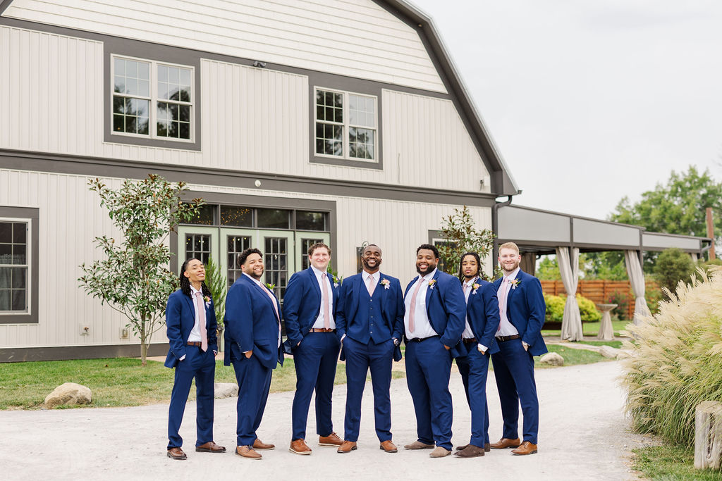 Groomsmen in front of the barn at The Marmalade Lily