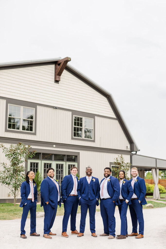 Groomsmen in front of the barn at The Marmalade Lily