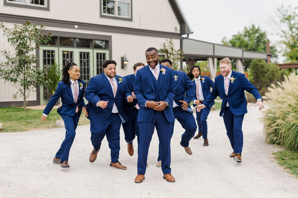 Groomsmen in front of the barn at The Marmalade Lily