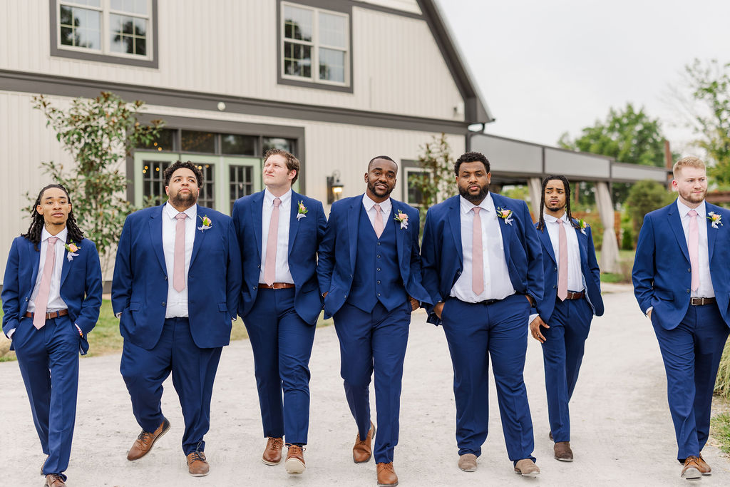 Groomsmen in front of the barn at The Marmalade Lily