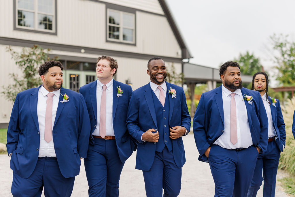 Groomsmen in front of the barn at The Marmalade Lily